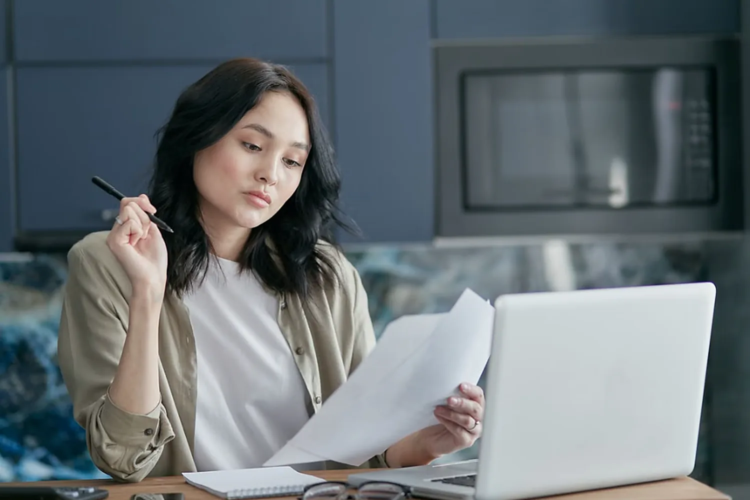 A consumer reviewing credit reports and planning their next steps at a desk.